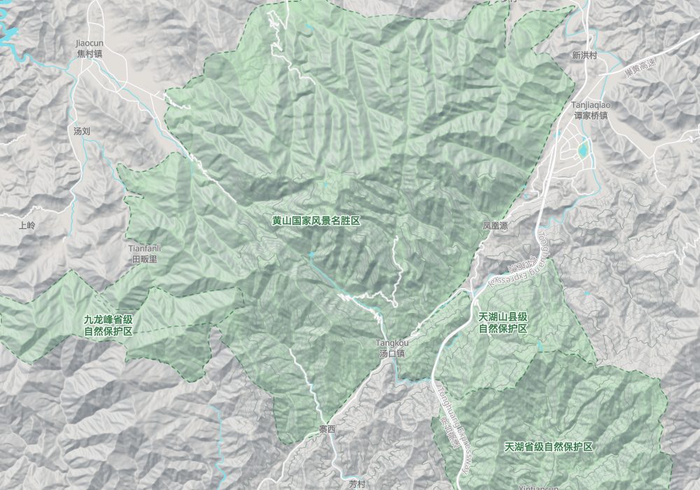 The Huangshan scenic area (green) and its surroundings: the south gate at Tangkou, the Tongling–Huangshan expressway to the east; hillshade and 100 m contours