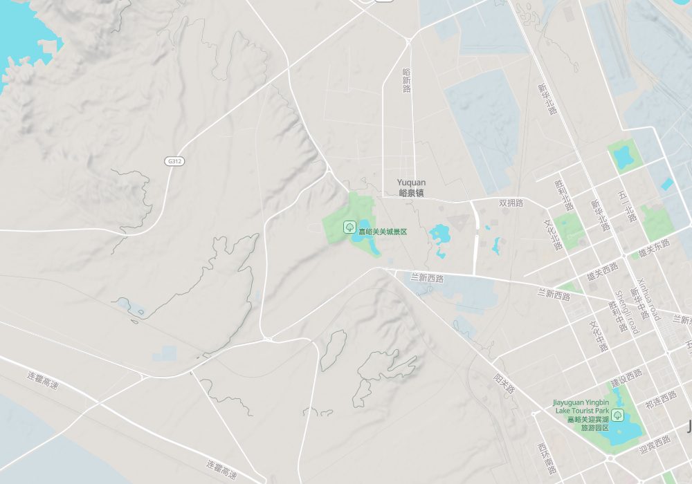 The Jiayuguan fort is left of centre (south-west of Yuquan town), with the city of Jiayuguan to the east; the Overhanging Great Wall lies north of the fort and the First Beacon Tower south of it on the Taolai River, both just off the map; hillshade and 100 m contours