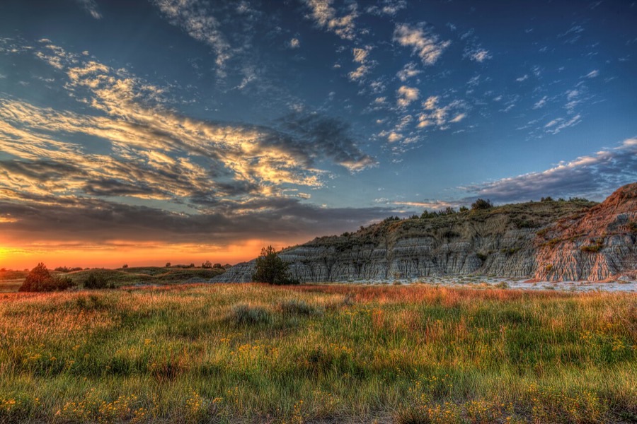 Badlands and prairie at sunset